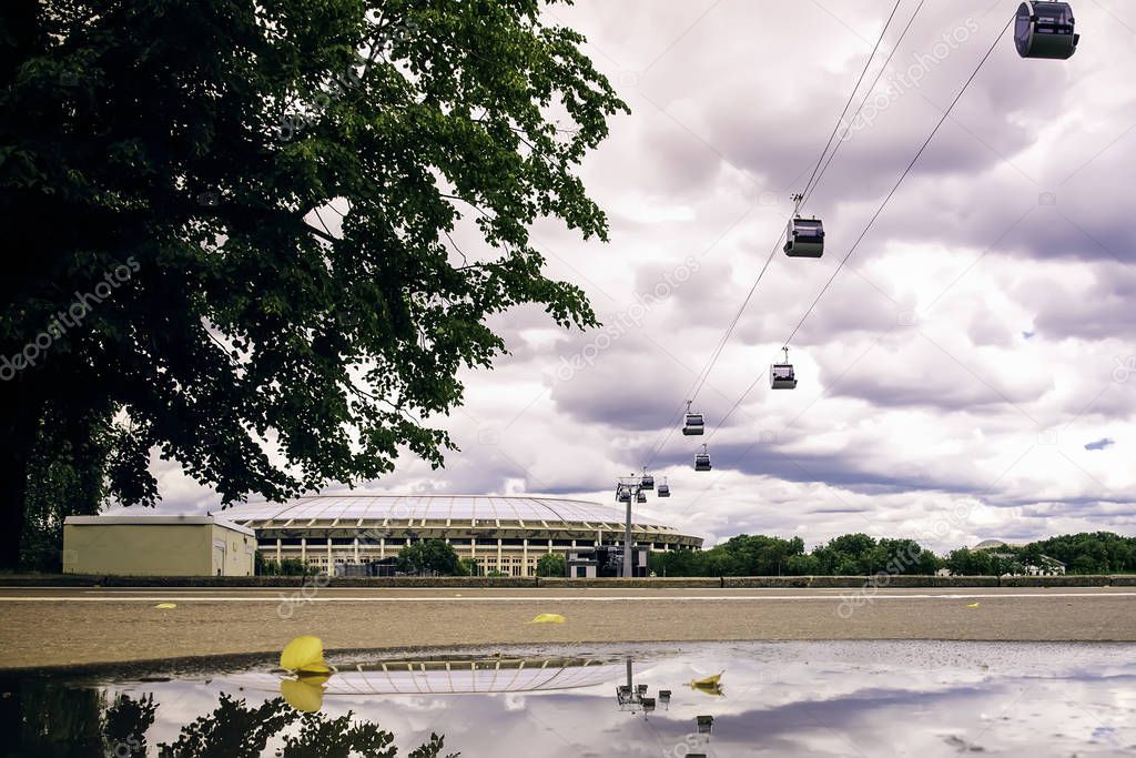 Aerial funicular cableway between Luzhniki stadium and Sparrow Hills (Vorobyovy Gory) over the Moskva River  in summer. Cable car in Moscow, Russia. 