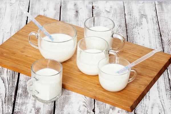 Milk with cocktail straws for breakfast — Stock Photo, Image