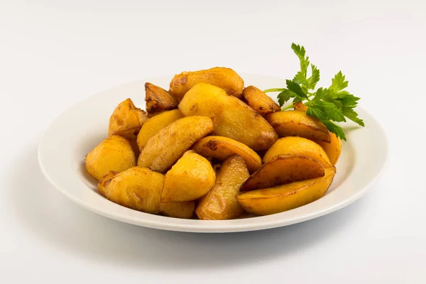 Fried potatoes on a white plate Royalty Free Stock Images