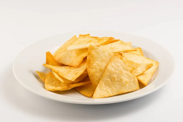 Potato nachos on a white plate Stock Photo