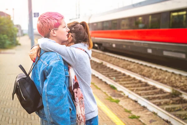 Two Young Women Outdoors Hugging Train Station Farewell Leaving Sadness — Stock Photo, Image