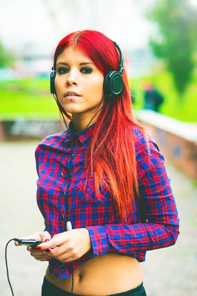 Young Redhead Woman Venezuelan Listening Music Looking Away Headphones — Stock Photo, Image