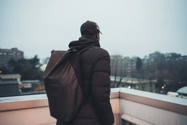 Young african man outdoors posing parking lot looking away — Stock Photo, Image