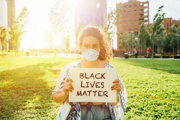 Young Mixed Race Face Mask Woman Holding Black Lives Matter — Stock Photo, Image