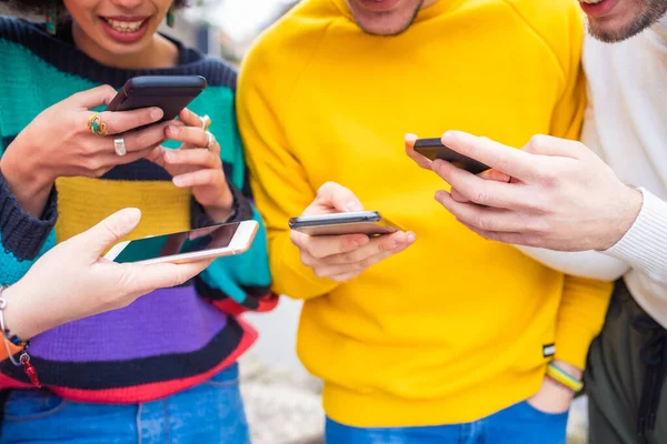 Middle section people hands using smartphones banking, networking or shopping