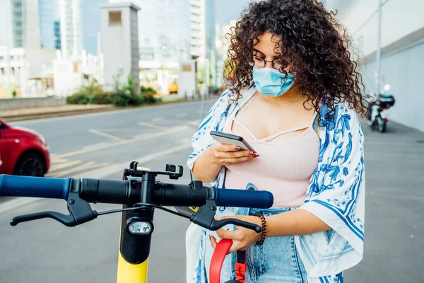 Young Multiethnic Woman Wearing Mask Unlocking Escooter Diverse Ecological Female — Stock Photo, Image