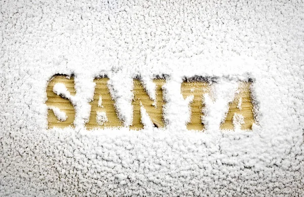 Santa Namn Skrivet Snön Avslöjar Trästruktur Bakgrund — Stockfoto
