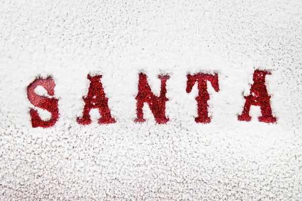 Santa Namn Skrivet Mjuk Snö Fönstret Avslöjar Röd Glittrande Jul — Stockfoto