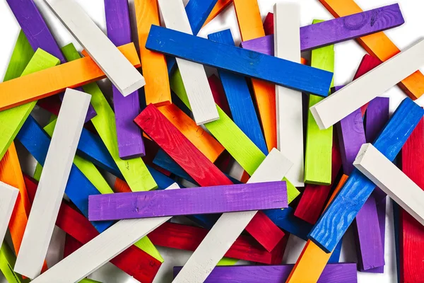 Colored chaos of wood sticks isolated on white with white sticks