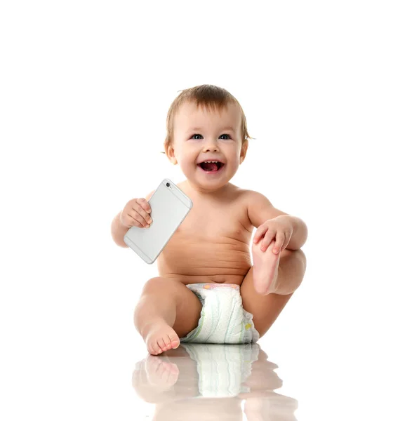 Infant child baby girl toddler playing with mobile cellphone happy smiling — Stock Photo, Image