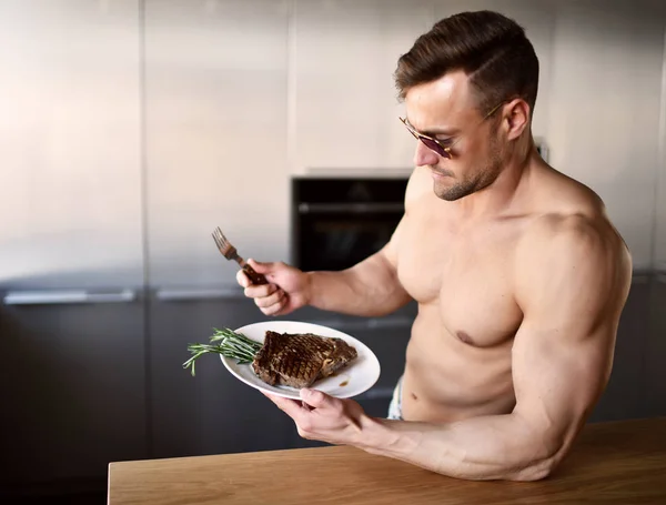 Man ready to eat cut with fork and knife grill beef steak on a kitchen — Stock Photo, Image