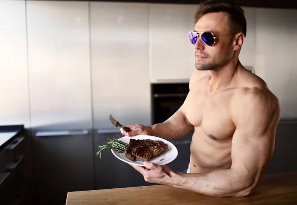 Man ready to eat cut with fork and knife grill beef steak on a kitchen — Stock Photo, Image