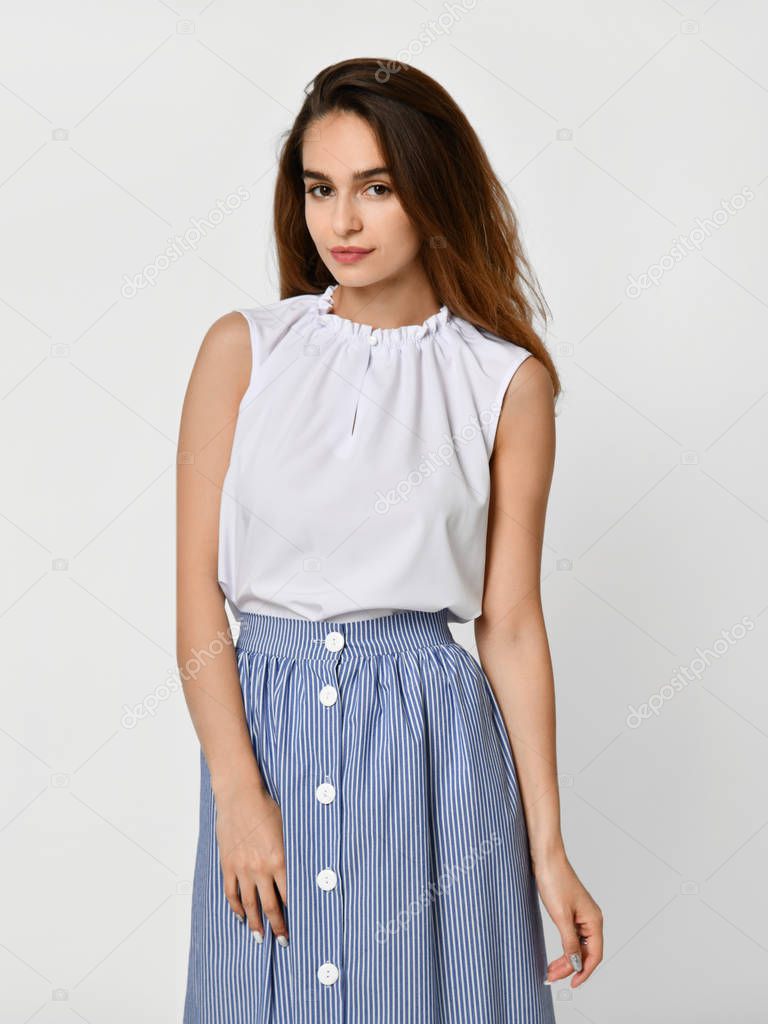 Young beautiful woman posing in new casual office cloth