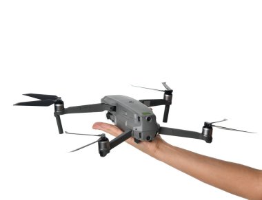 Kadın el ile üzerine beyaz izole dijital fotoğraf makinesi yeni küçük taşınabilir dron quadcopter tutun