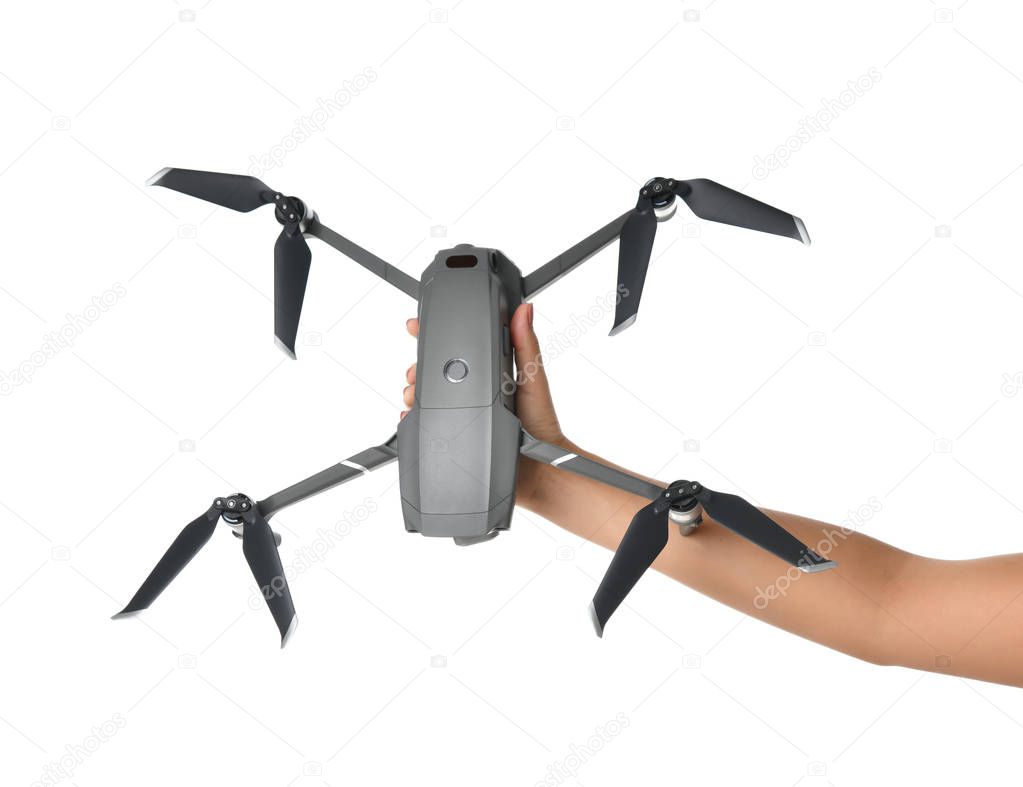Woman hand hold new small portable drone quadcopter with digital camera isolated on white