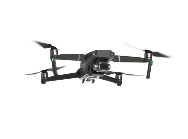 Ny drone quadcopter med digitalkamera og der flyver på hvid Stock-billede