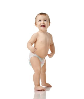 Infant child baby girl kid toddler in diaper  make first steps standing happy smiling laughing isolated on a white clipart