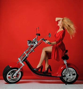 Woman ride electric motorcycle bicycle scooter for new year 2019 in red dress happy laughing smiling on red clipart