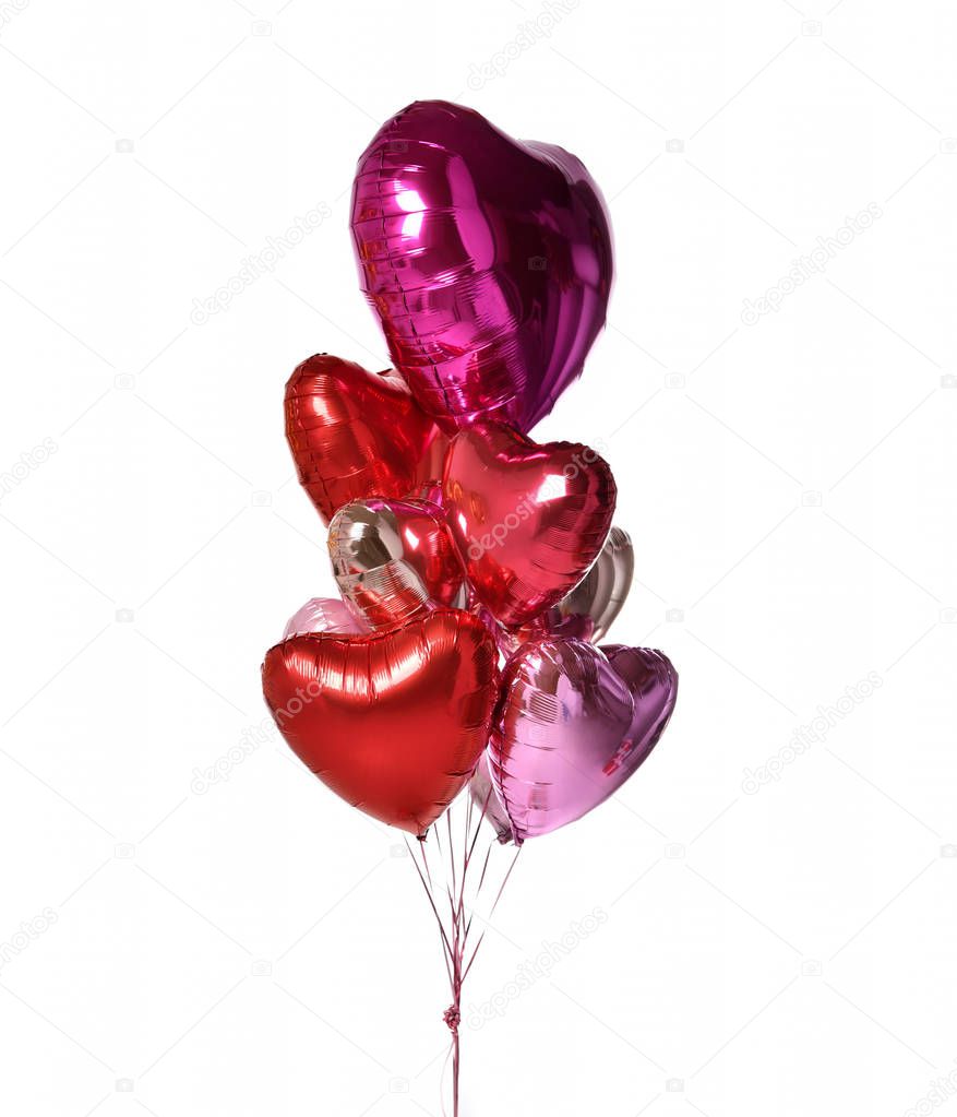 Bunch of metallic red pink heart balloons composition objects for birthday or valentines party isolated on a white 