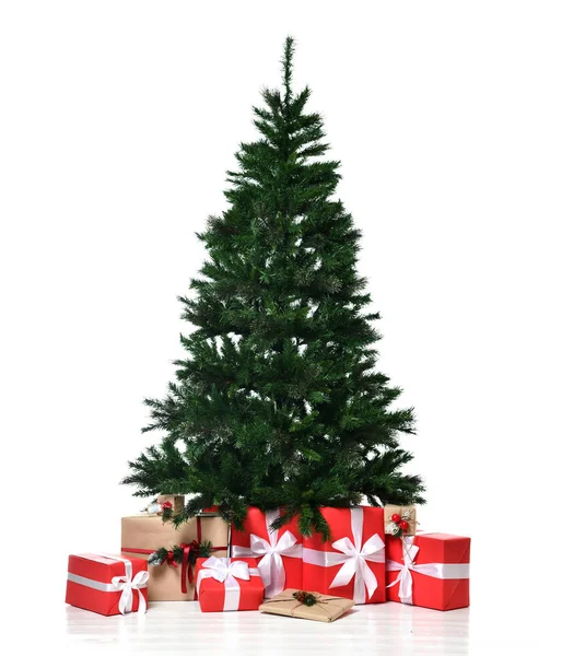 Christmas tree for New Year celebration  with red and craft presents gifts surprise — Stock Photo, Image