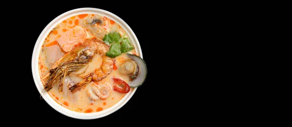 Tom yam kong or Tom yum spicy Thailand Dish Cuisine soup with king prawn chili pepper and mashrooms