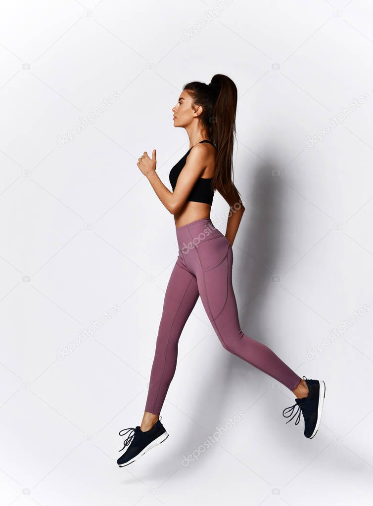 Slim brunette woman running jogging doing  workout exercise in sport wear 