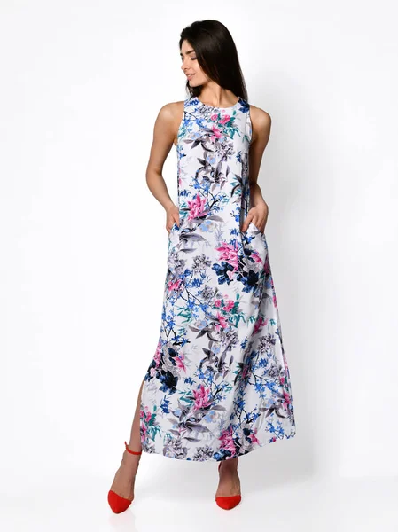 Young beautiful woman posing in new summer blue flowers fashion dress on high hills full body on a white — 스톡 사진