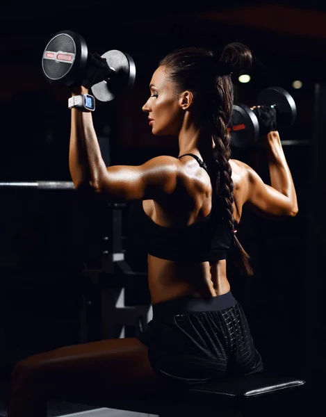 Young fitness woman working out with dumbbells weight in Gym. Diet and weight loss concept — Stock Photo, Image