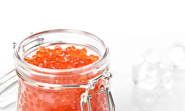 Plastic container with red caviar on white. Sea food. Healthy eating — Stock Photo, Image
