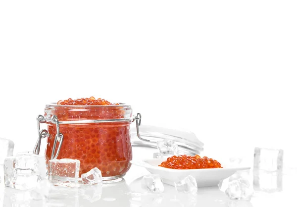 Salmon red caviar in jar can and little plate with ice on table. Sea food — Stock Photo, Image