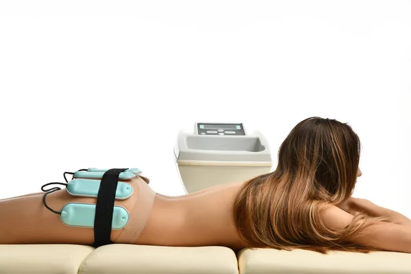 Doctor make anti cellulite and fat therapy massage for woman on buttocks. Body care. Ultrasound deep cavitation body