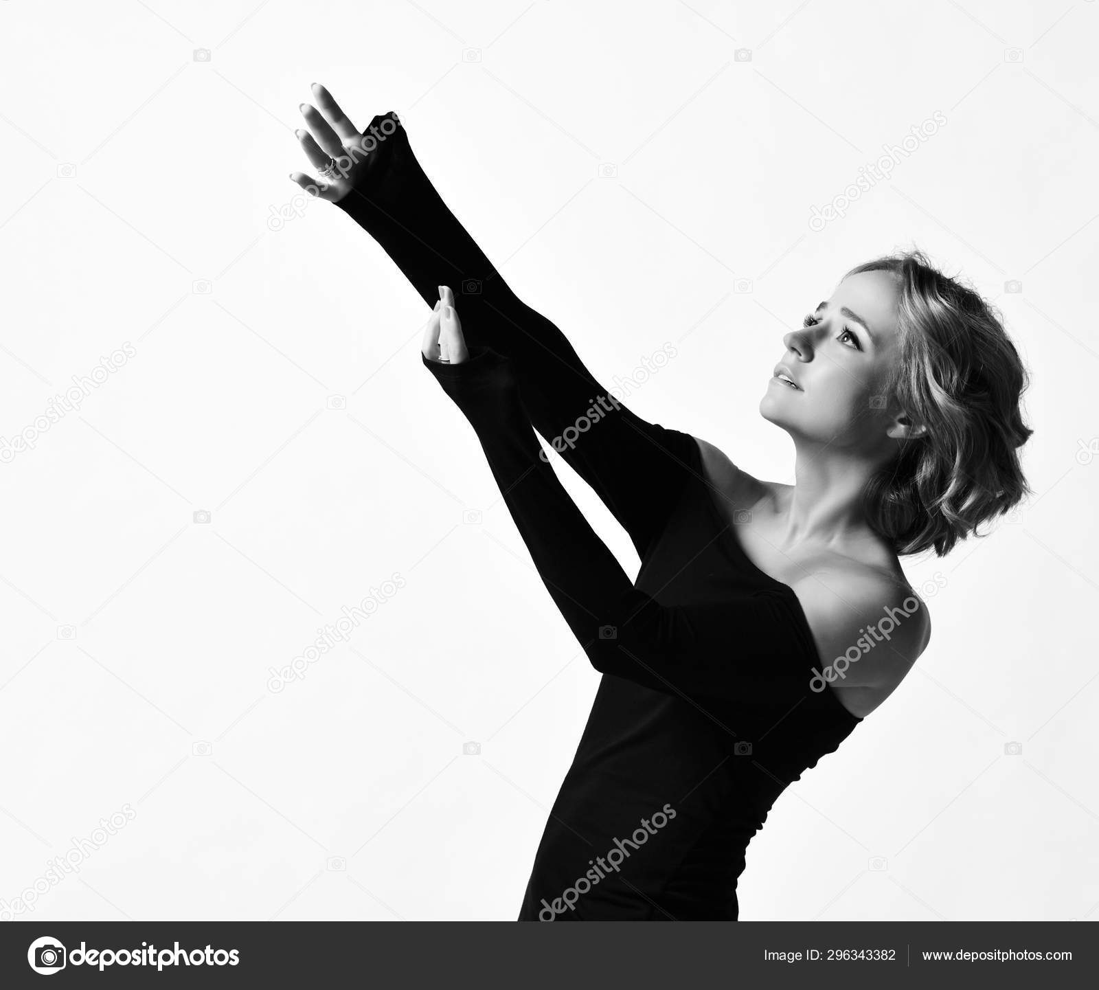 Young Woman Actress With Curly Blonde Hair In Black Tight Dress