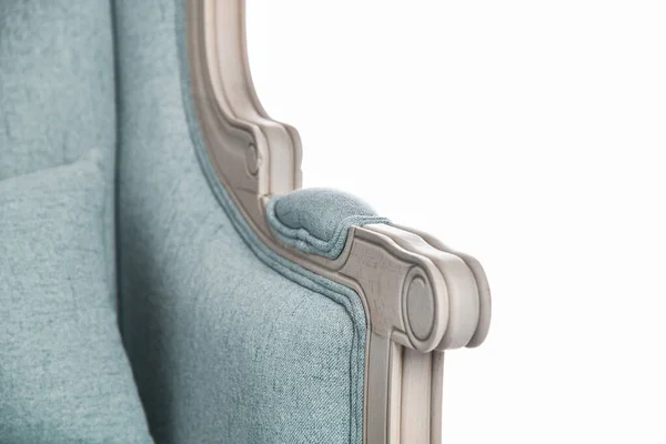 Fashionable modern retro pastel light blue armchair closeup details with wood. Furniture, interior object, stylish armchair