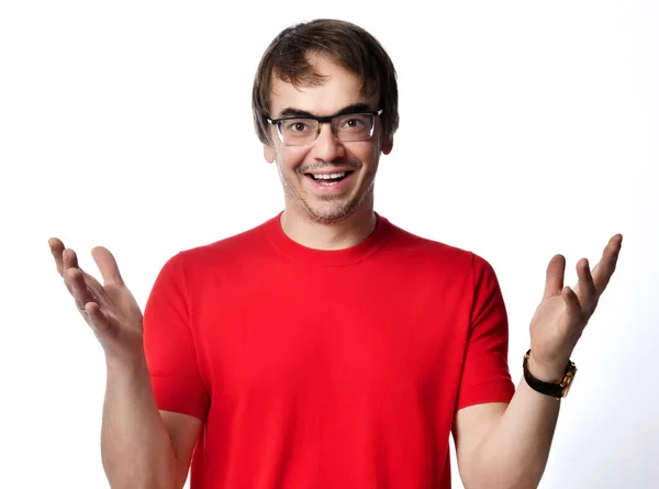 Smiling laughing friendly adult man in red t-shirt and glasses holds hands up and spread wide, greeting — Stock Photo, Image