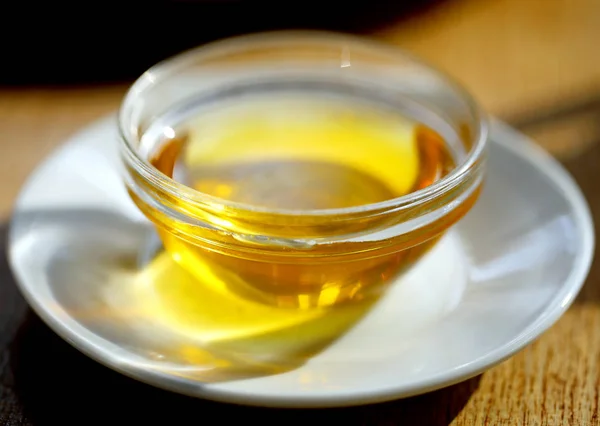 Beautiful saucer with honey on a plate photographed — Stock Photo, Image