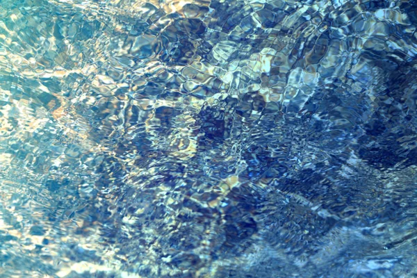 Hermosa textura de agua de mar azul fotografiada —  Fotos de Stock