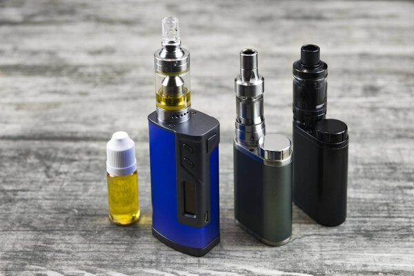 E - cigarette for vaping , technical devices.The liquid in the bottle