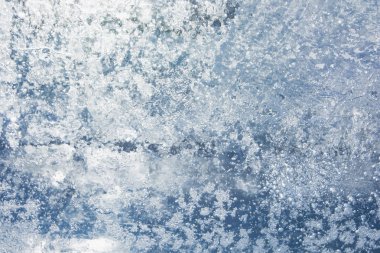 Donmuş buz kış gölde bir desen ile doku. Noel için kış arka plan