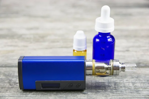 Electronic cigarette for vaping, technical devices.The liquid in the bottle. Current, drip.