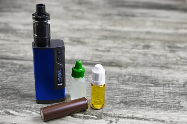 Electronic cigarette for vaping, technical devices.The liquid in the bottle. Current, drip.