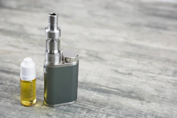Electronic cigarette for vaping, technical devices.The liquid in the bottle. Current, drip.