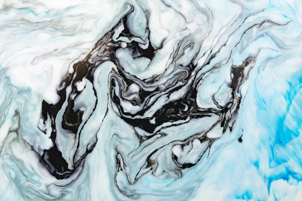 抽象美丽的蓝色大理石图案与黑色 东方风格的埃布鲁绘画在水面上与丙烯酸油漆漩涡 时尚的色彩组合 自然奢华 图库照片