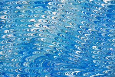 Güzel soyut mavi Ebru tekniğinde çizim. Ebru su ile akrilik boyama Türk usulü swirls dalgalar boyar. Doğal lüks şık bir arada 