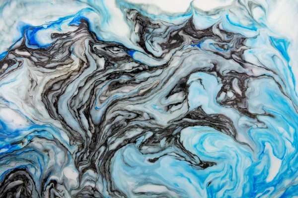 Beautiful abstract Ebru drawing technique .Turkish style of painting Ebru on water with acrylic paints twists the waves.A stylish combination of natural luxury