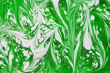 Güzel soyut resim teknikleri Ebru çizim. Türk stilinde Ebru boyama ile su üzerine akrilik boyalar dalgalara katlanmış. Doğal lüksün şık bir kombinasyonu. Çağdaş marming sanatı