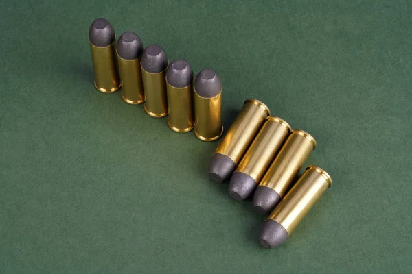 Western Style Revolver Cartridges Green Background — Stock Photo, Image