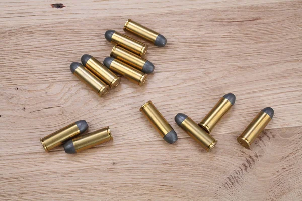 Revolver Cartridges Wooden Background — Stock Photo, Image