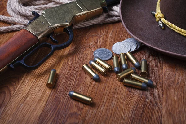 Wild West Rifle Ammunition Silver Dollars Wooden Table — Stock Photo, Image