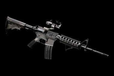 M4 assault rifle with optic sight isolated on black background clipart
