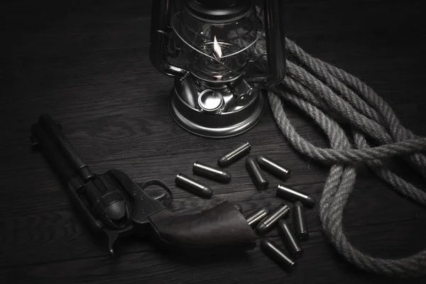 Old western cold blast lantern and revolver with cartridges — Stock Photo, Image